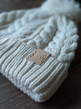 Load image into Gallery viewer, Bowland Cable Knit Bobble Beanie in Cream
